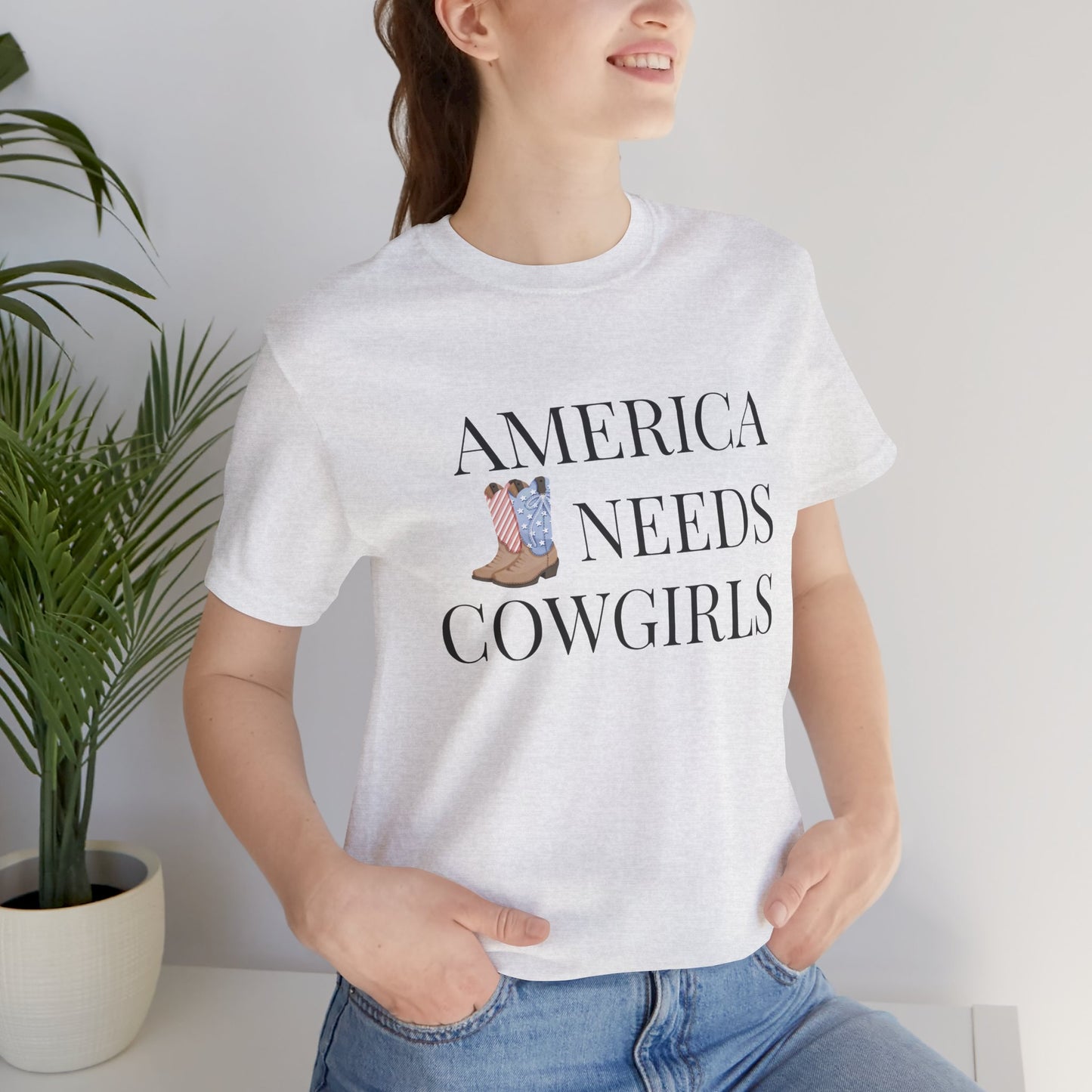 America Needs Cowgirls Tee — Cowboy Boots Graphic Shirt