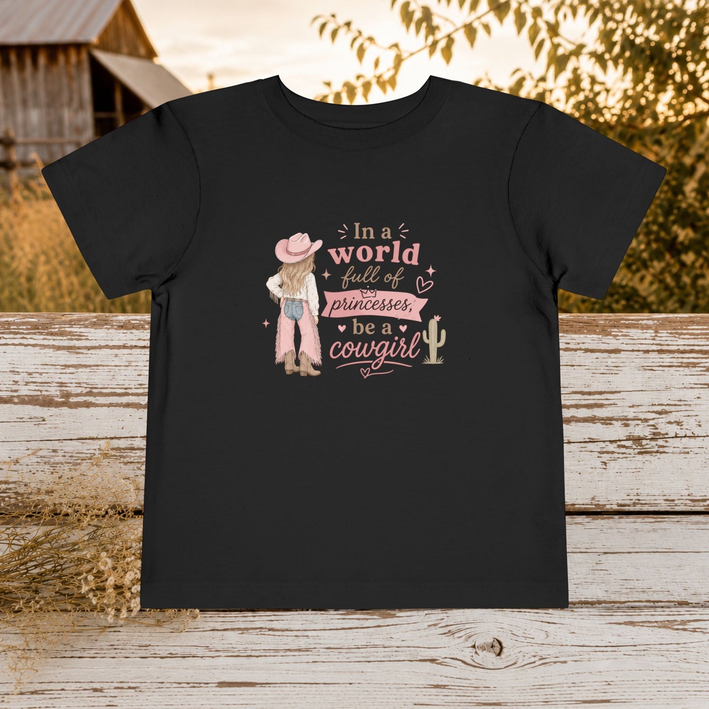 Toddler Cowgirl Tee — "In a World Full of Princesses, Be a Cowgirl" Pink Western Shirt
