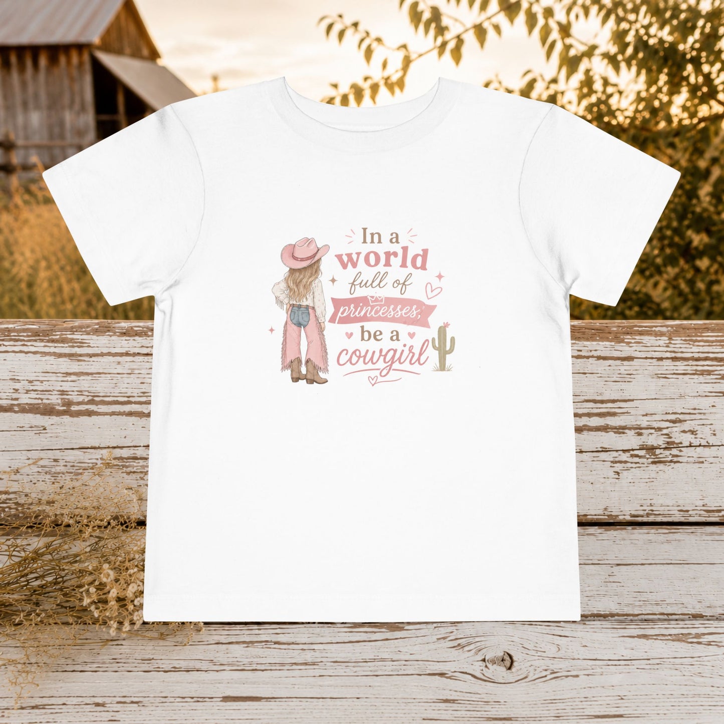 Toddler Cowgirl Tee — "In a World Full of Princesses, Be a Cowgirl" Pink Western Shirt