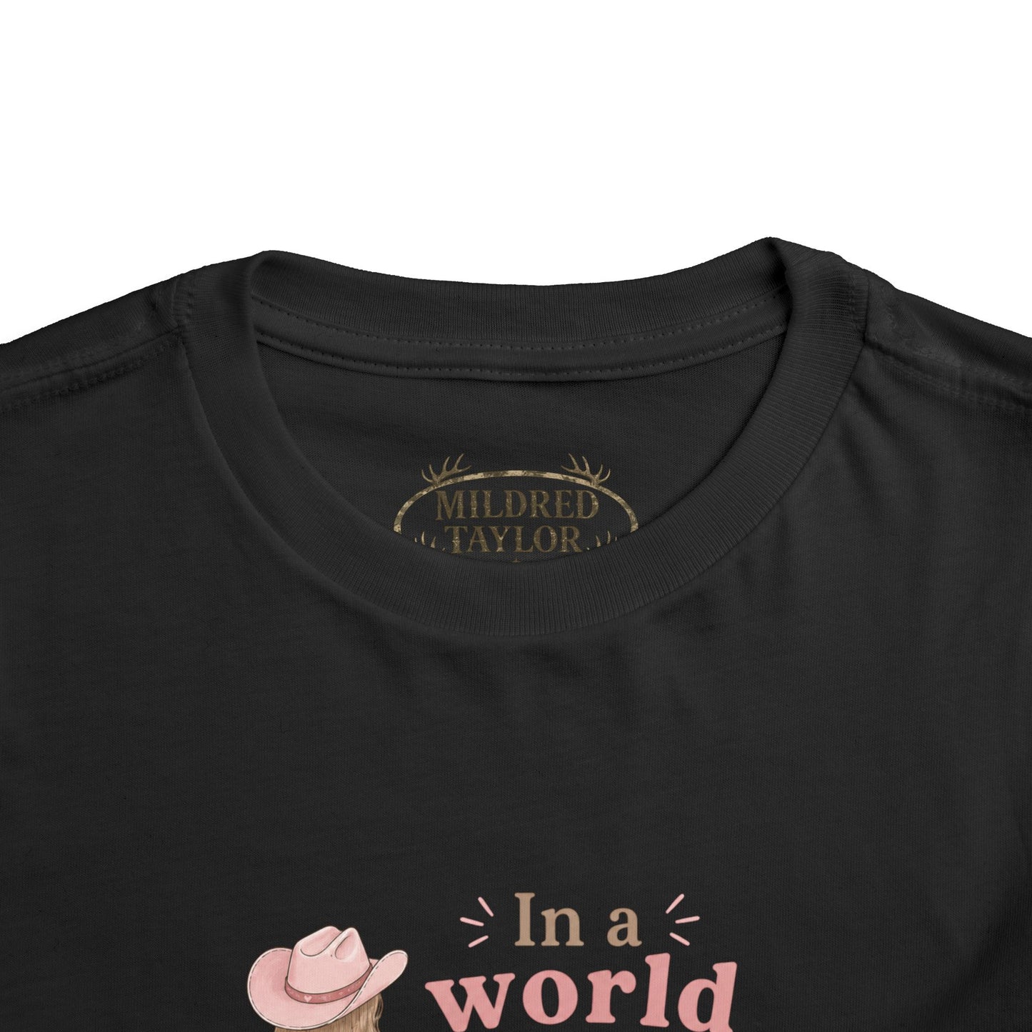 Toddler Cowgirl Tee — "In a World Full of Princesses, Be a Cowgirl" Pink Western Shirt