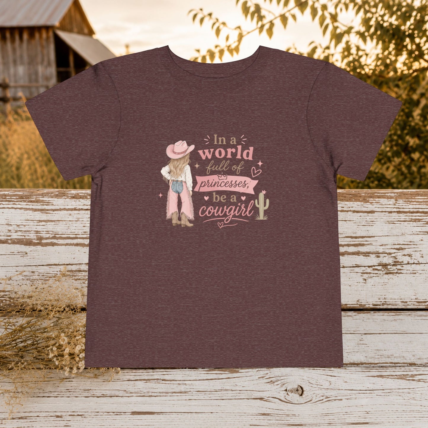 Toddler Cowgirl Tee — "In a World Full of Princesses, Be a Cowgirl" Pink Western Shirt